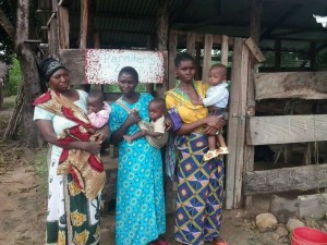 The Mamas' Group in front of their cow banda.